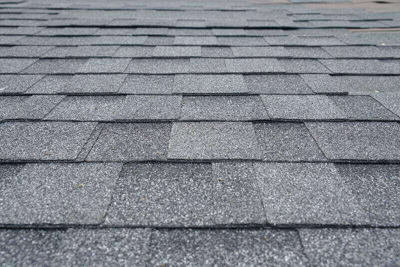 A close up of a shingled roof by NorCal Roofing & Gutters