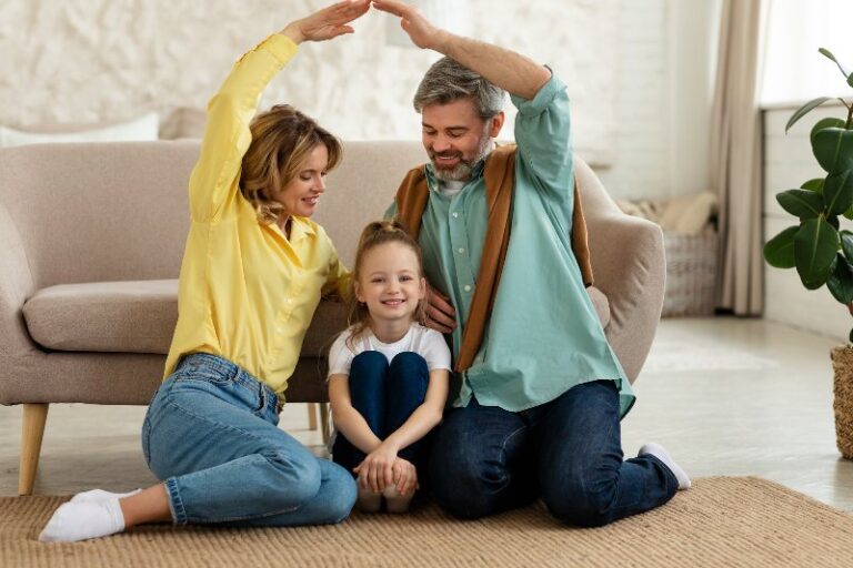 A family holding their arms up in protection by NorCal Roofing & Gutters