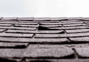 Damaged roof of a house showing the early detection of roof repair in Stockton and Roseville, CA.