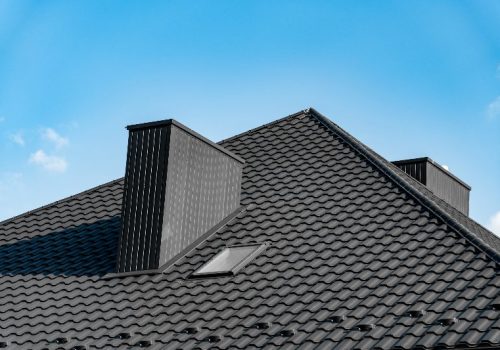 An energy-efficient roof by a blue sky by NorCal Roofing & Gutters