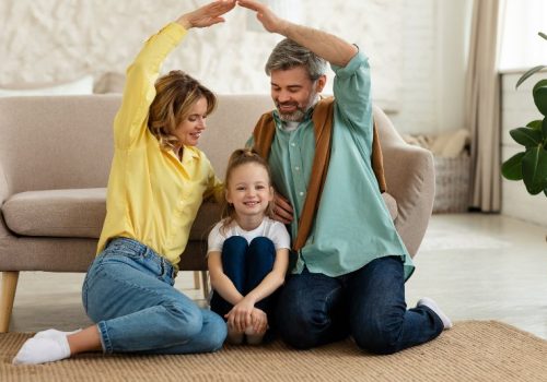 A family holding their arms up in protection by NorCal Roofing & Gutters