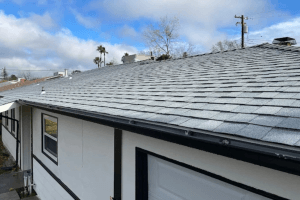 A residential home in Stockton and Roseville, CA, with a gray shingled roof and a white garage